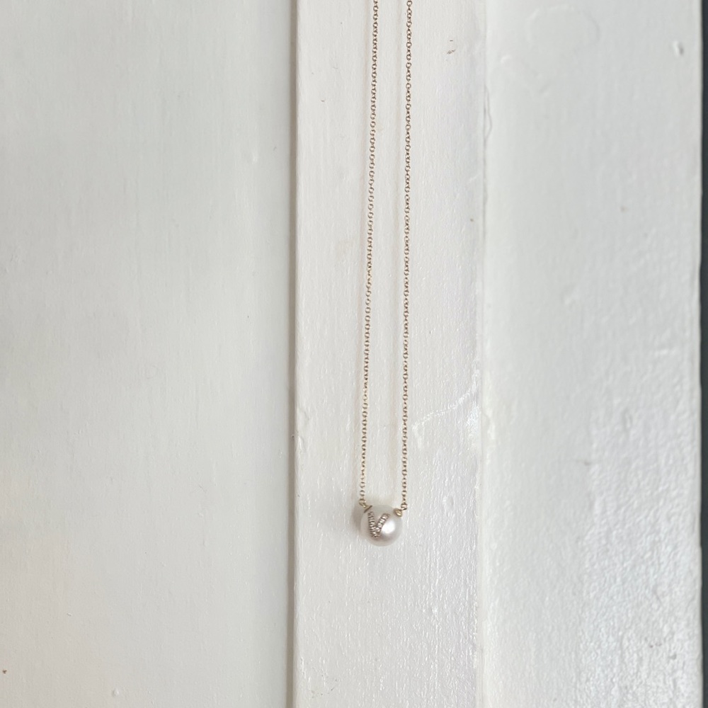 W.Rosado pearl ID necklace .